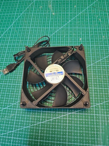 Rear view of the single USB cooling fan with corner fixings and a label showing sleeve bearing and DC5V