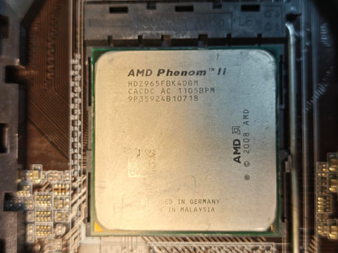 AMD Phenom II X4 965 processor model HDZ965FBK4DGM installed in ASUS motherboard