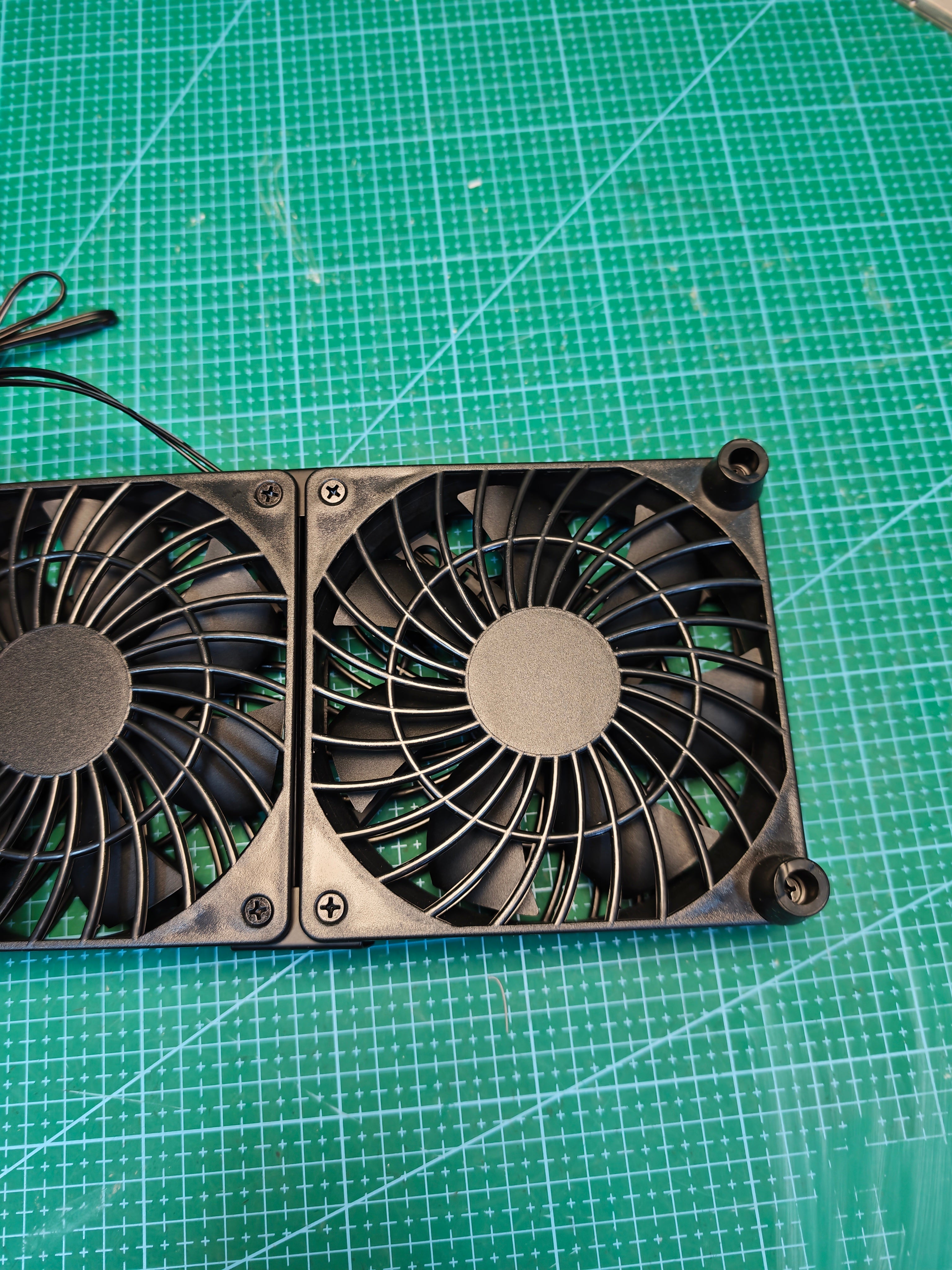 Rear view of the dual USB cooling fan unit, right fan and corner feet
