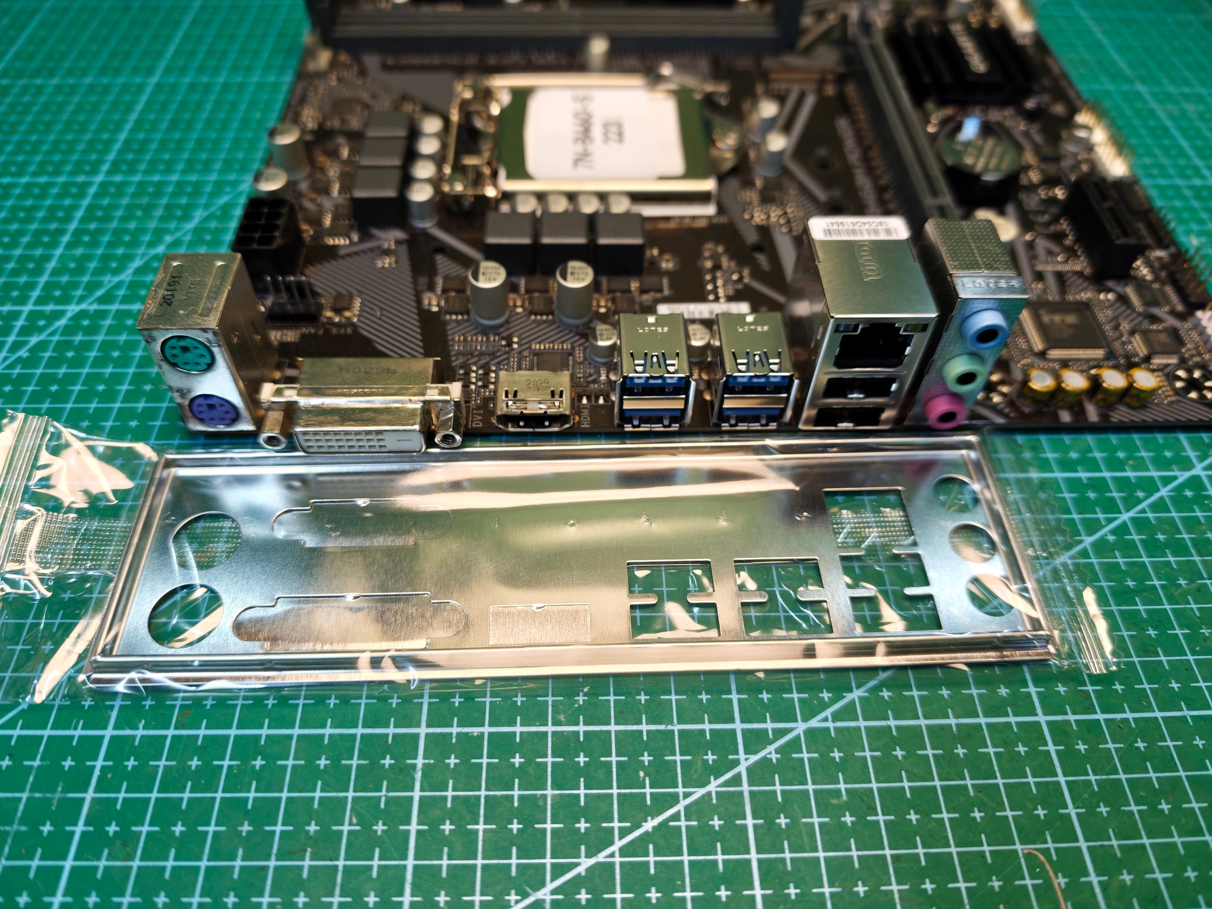GIGABYTE B460M POWER rear I/O with PS/2 keyboard and mouse ports, DVI-D, HDMI, USB Type-A, Ethernet and matching I/O shield