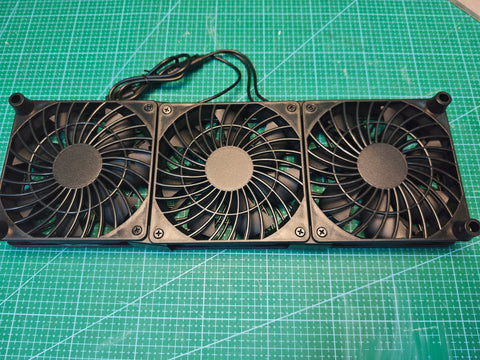Rear view of the black triple USB cooling fan unit with protective grilles and raised corner feet